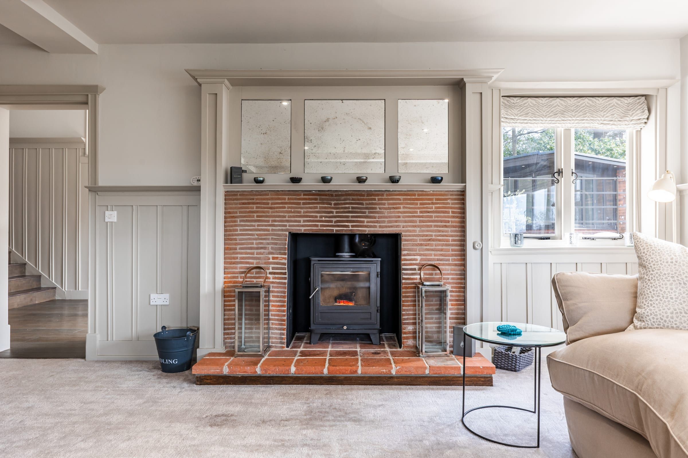 The drawing room fireplace with wood-burning stove