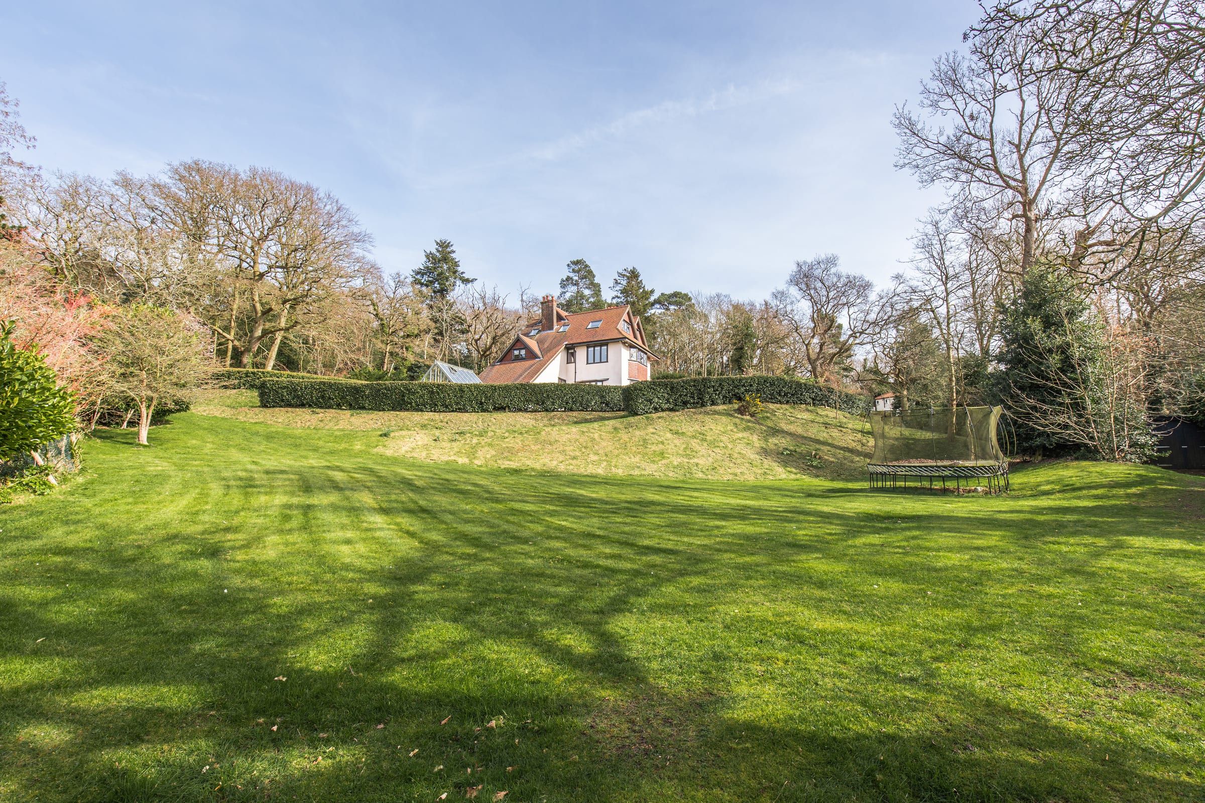 The rear garden and lawn, with the house beyond