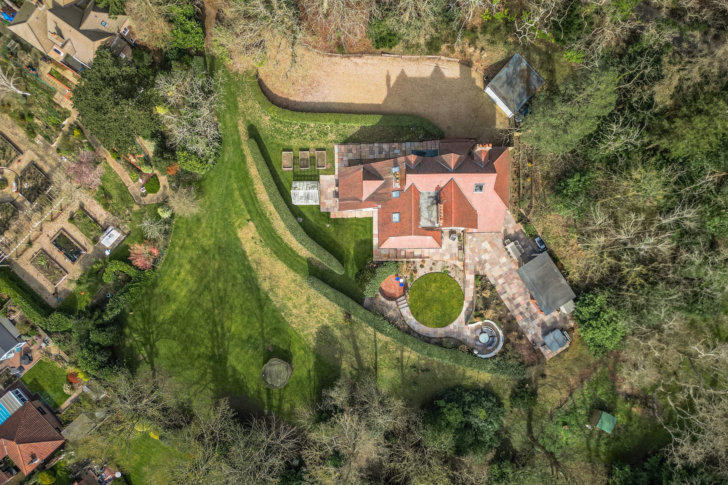 Aerial view of the grounds and surrounding woodland