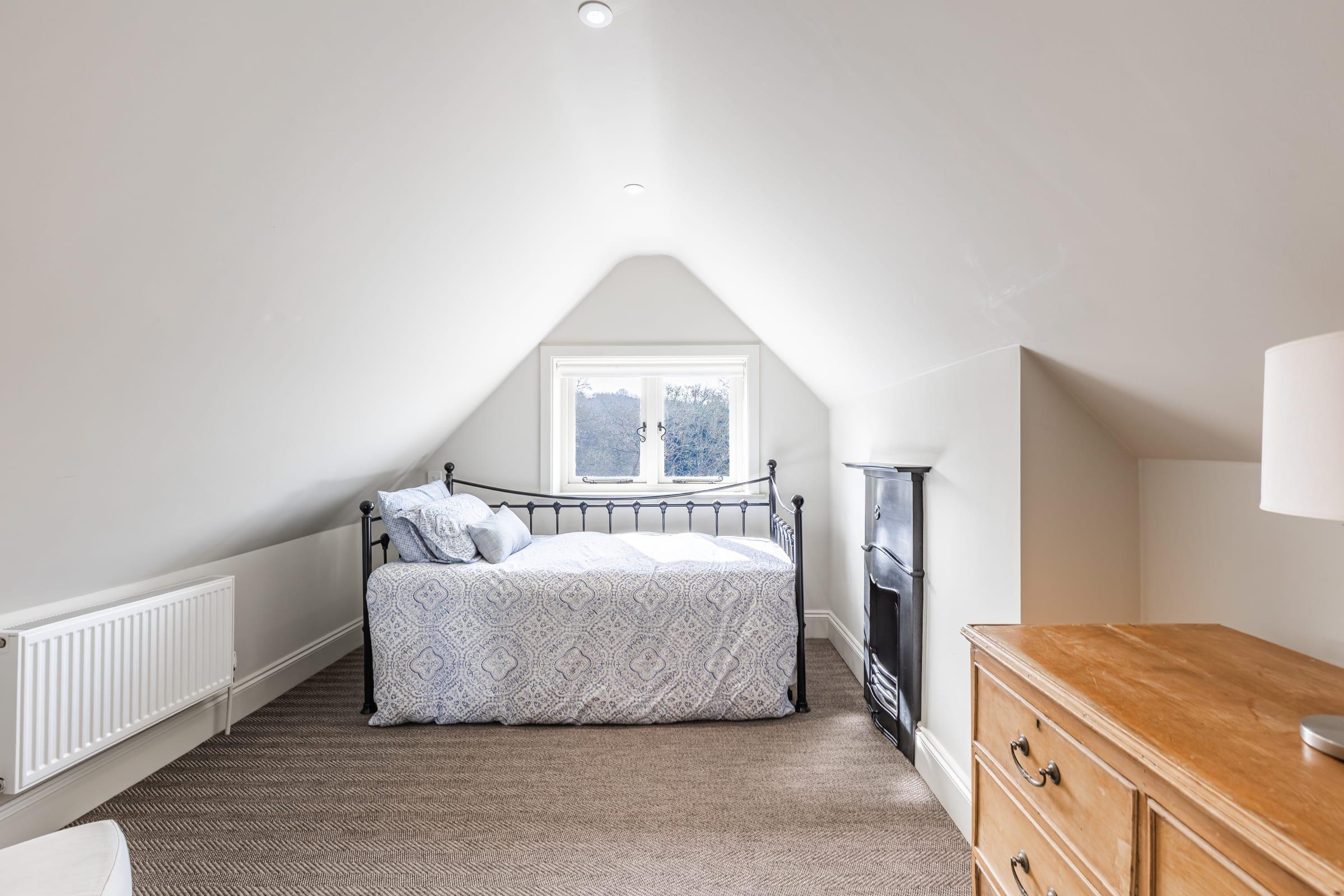 A bedroom with its own fireplace and a story to tell