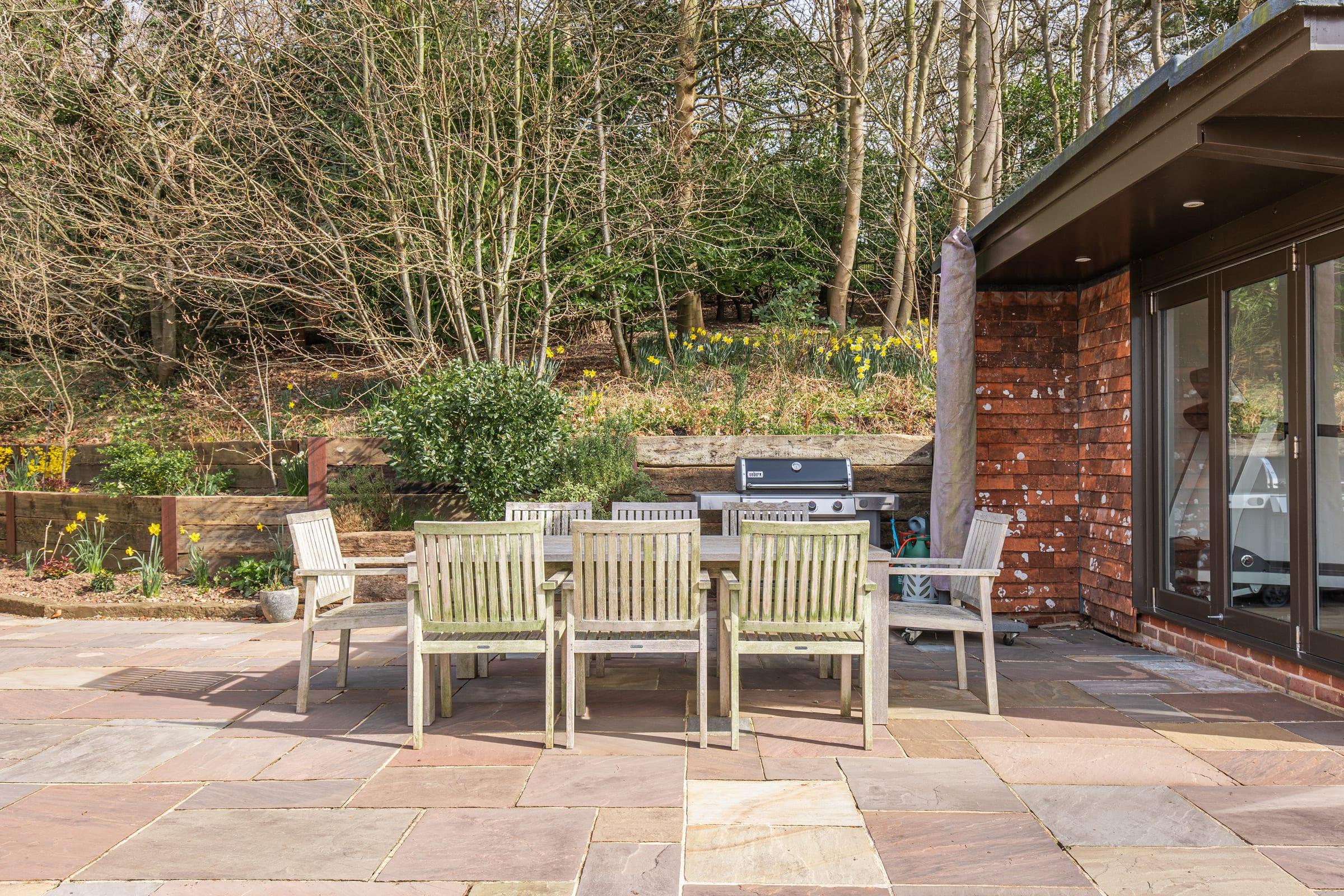 Long summer suppers on the stone patio, candles and dusk light
